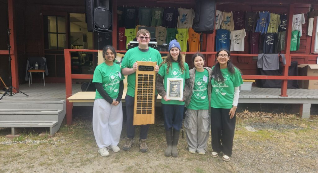 Kids holding up their envirothon awards